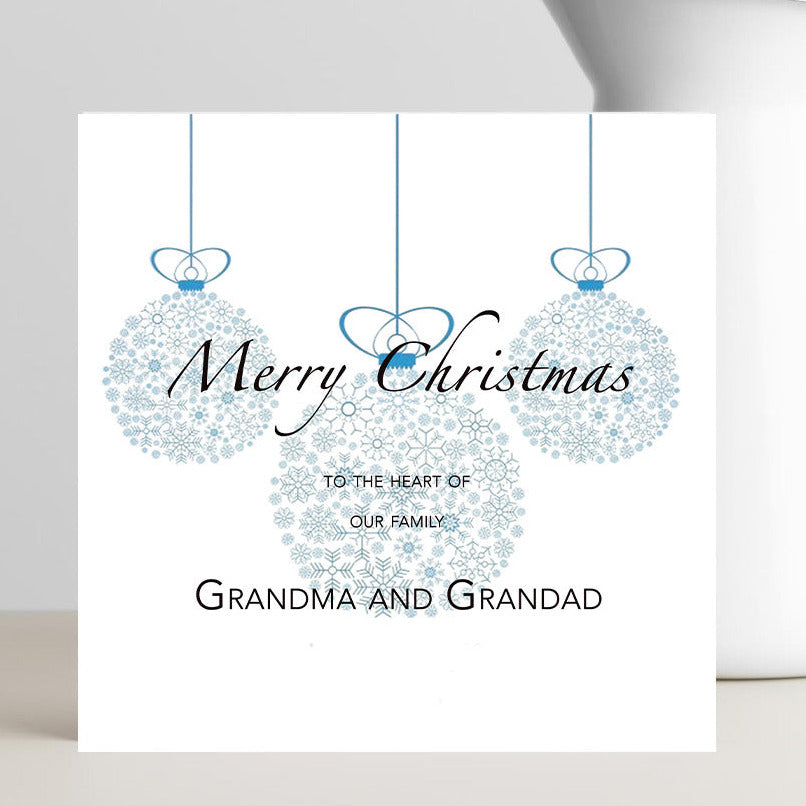 Minimalist Xmas card to the Heart of our Family card for grandparents with small red heart.