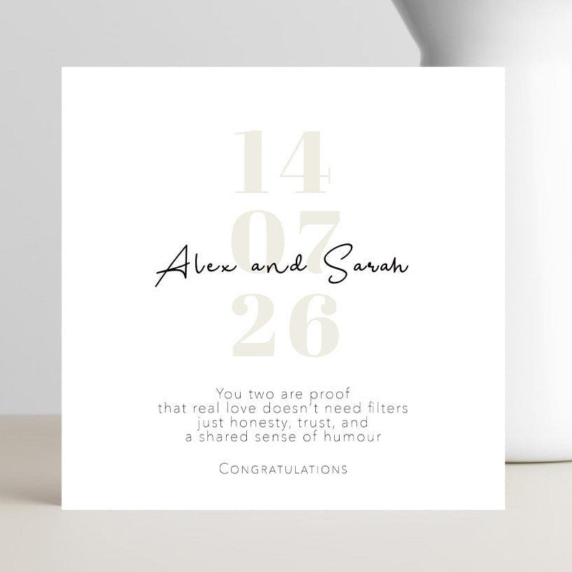 Personalised wedding card featuring modern typography with the couple’s names and wedding date, celebrating real love without filters.