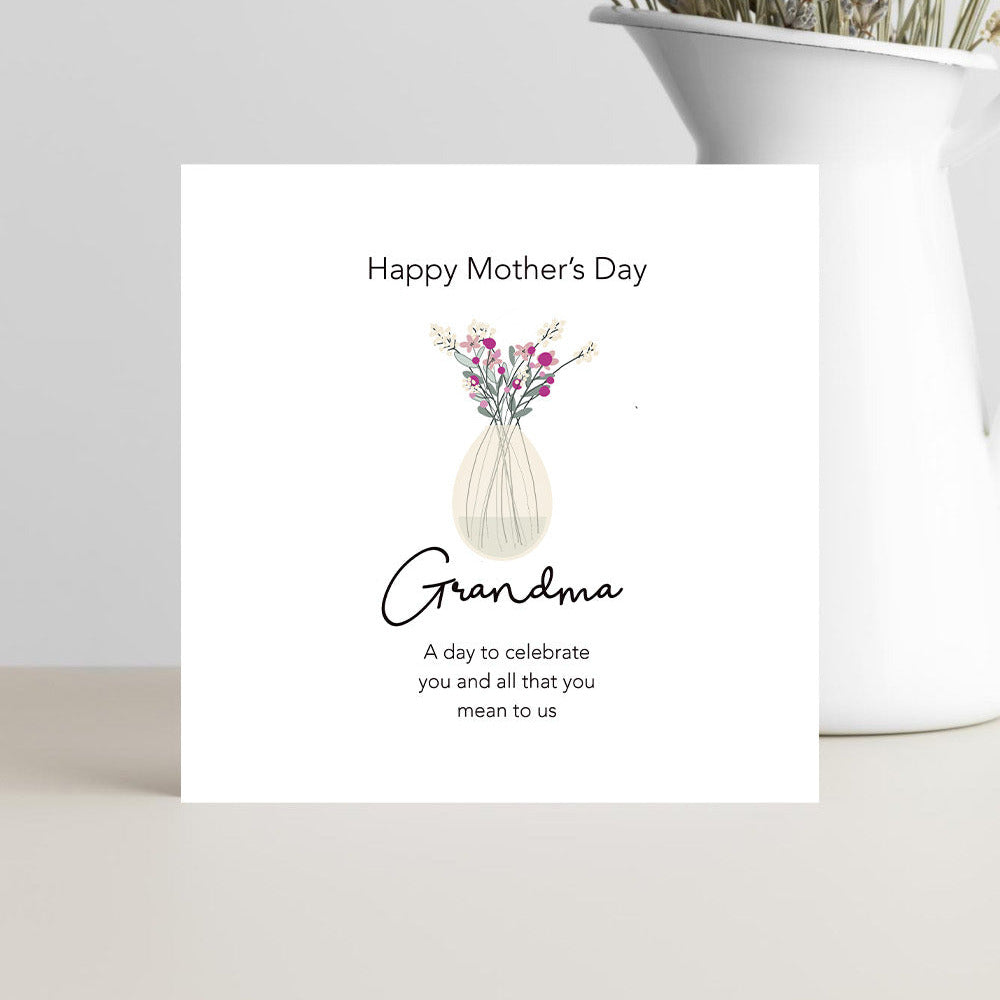 Mother's Day card for Grandma with a vase of flowers on a white surface.