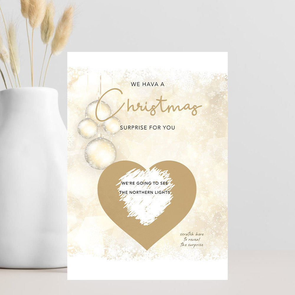 Christmas scratch card with gold text and heart design