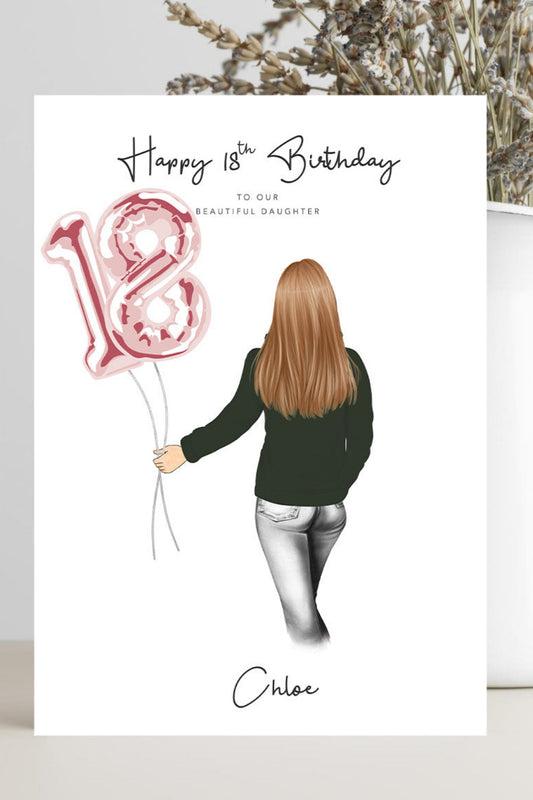 A personalized 18th birthday card with an illustration of a woman holding a pink '18' balloon, displayed in a styled setting next to a white vase with dried flowers.