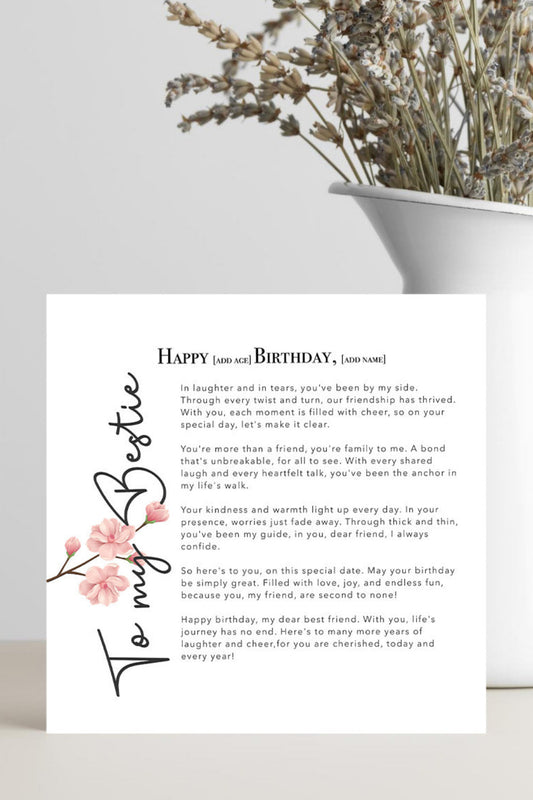 A printed birthday card with a floral design and placeholder text, displayed on a light surface next to a white planter with dried branches.