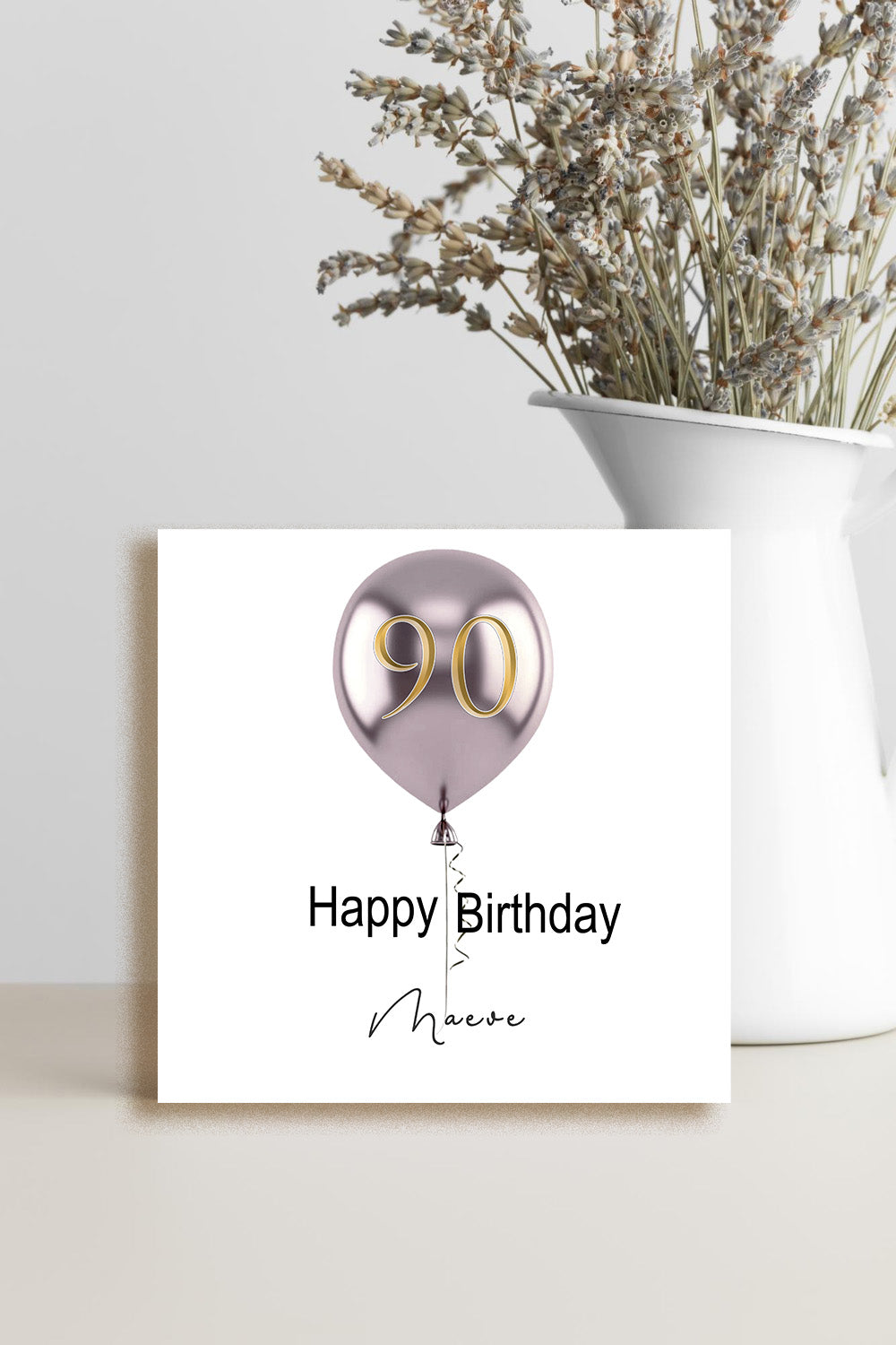 Handmade 90th birthday greeting card featuring a single balloon with the number 90 and a personalised name on the front.