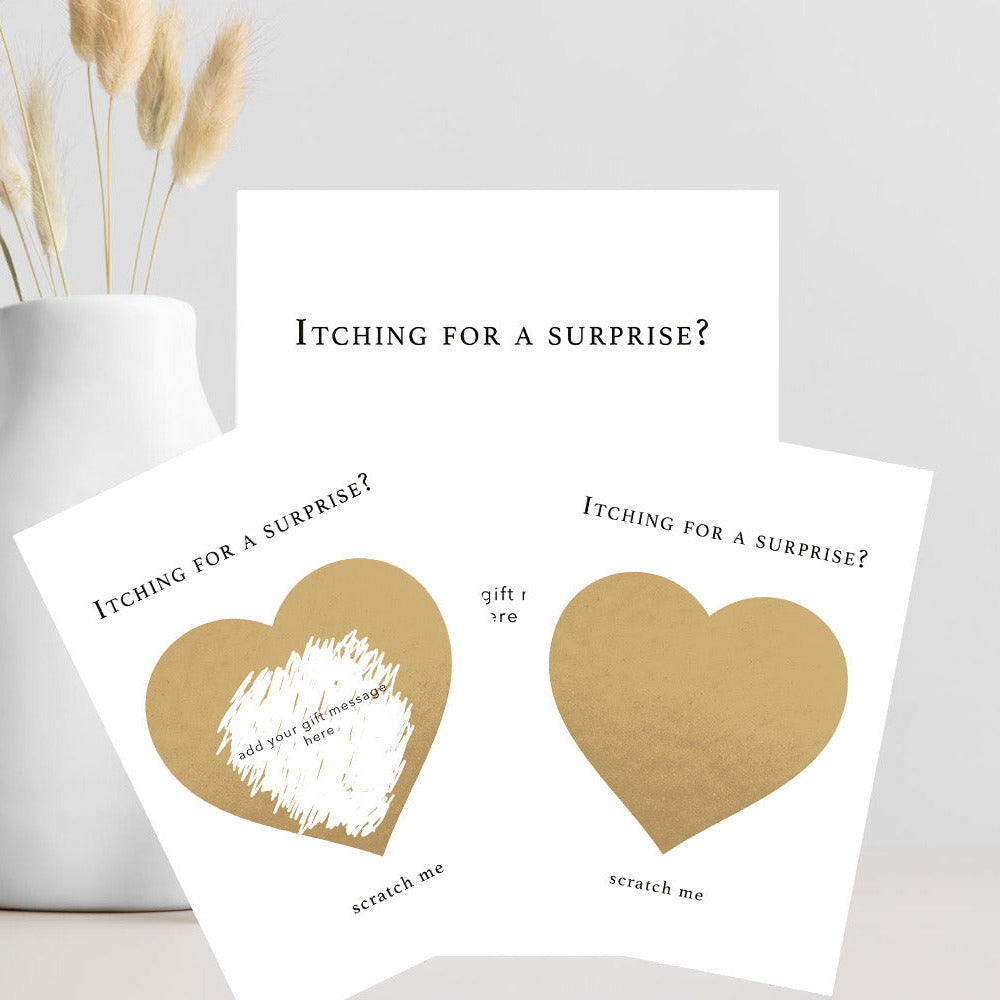 Personalised A6 scratch card with gold scratch-off heart, "Itching for a Surprise – Scratch Me" text, custom hidden gift message and kraft envelope.