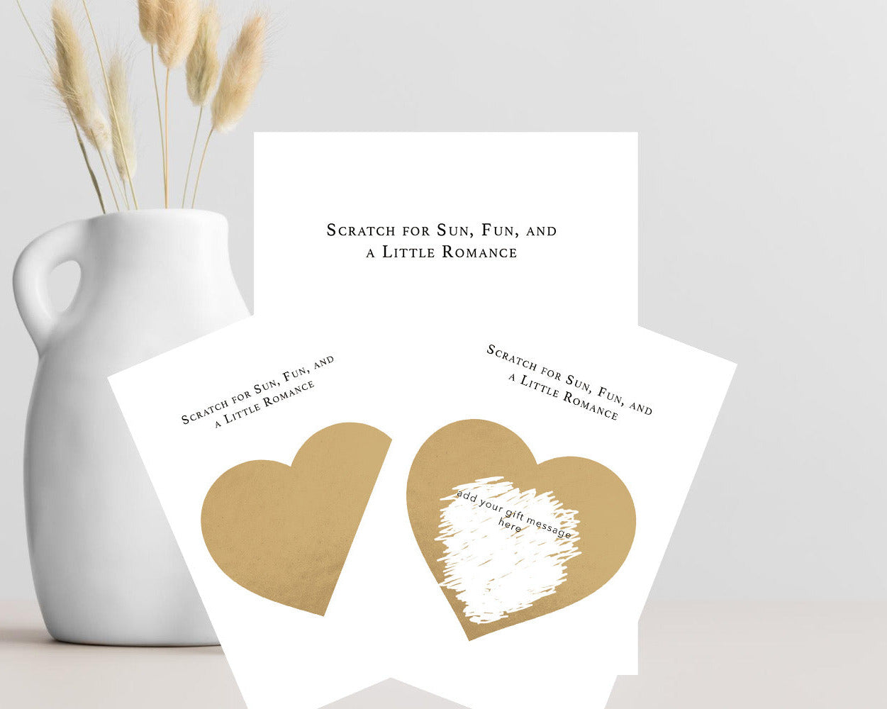 Personalised holiday reveal scratch card with gold scratch-off heart, hidden travel message, A6 card and kraft envelope.