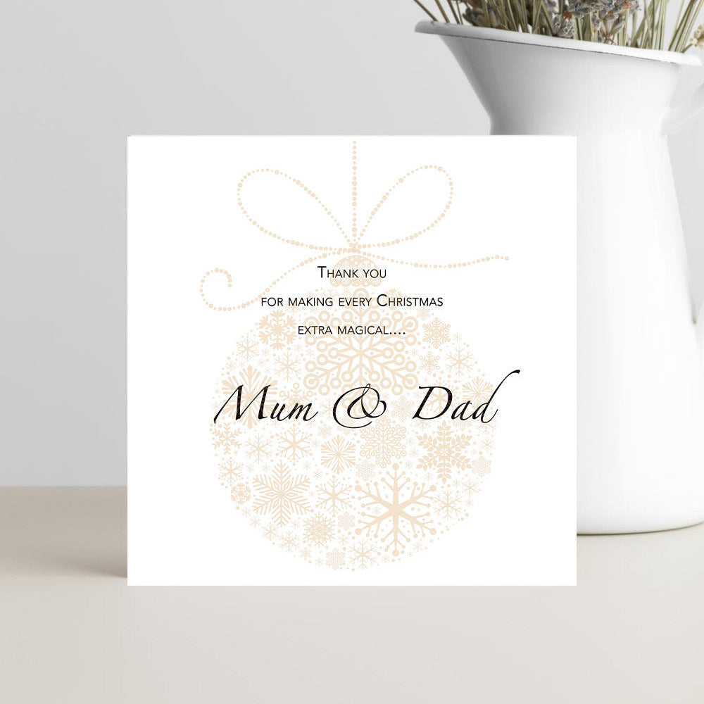 Greeting card with 'Thank you for making every Christmas extra magical... Mum + Dad' text on a white background.