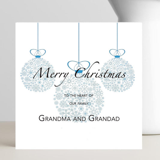 Minimalist Xmas card to the Heart of our Family card for grandparents with small red heart.