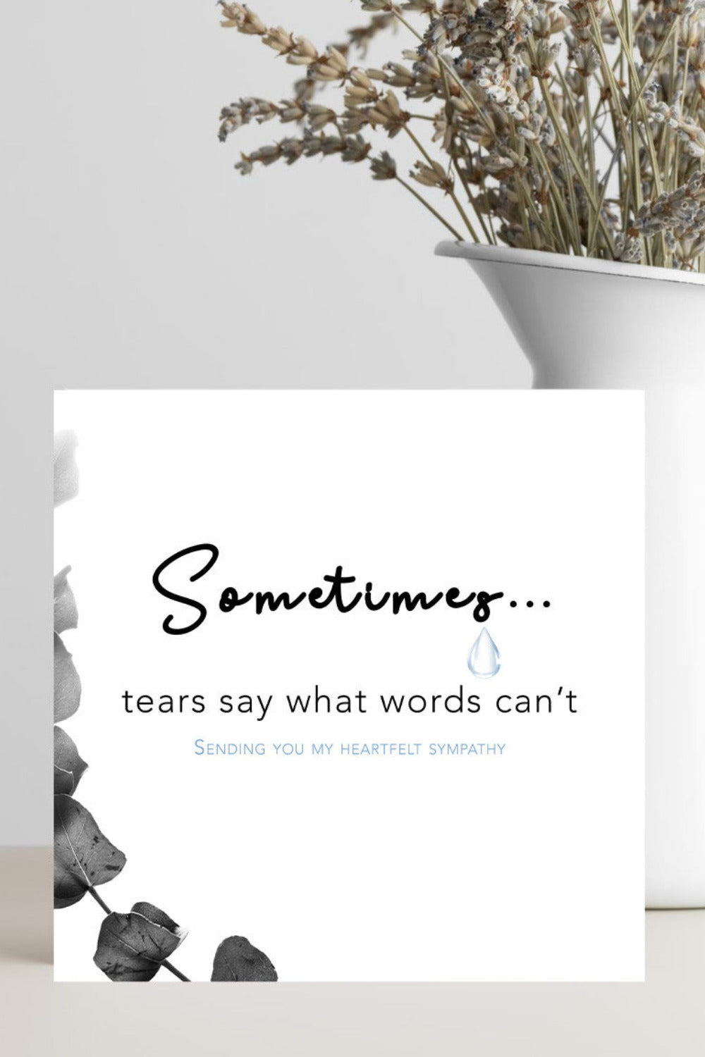 A soft, minimalist condolence greeting card displaying the message “Sometimes Tears Say What Words Can’t” in elegant script, placed on a neutral background with a calming, gentle tone.