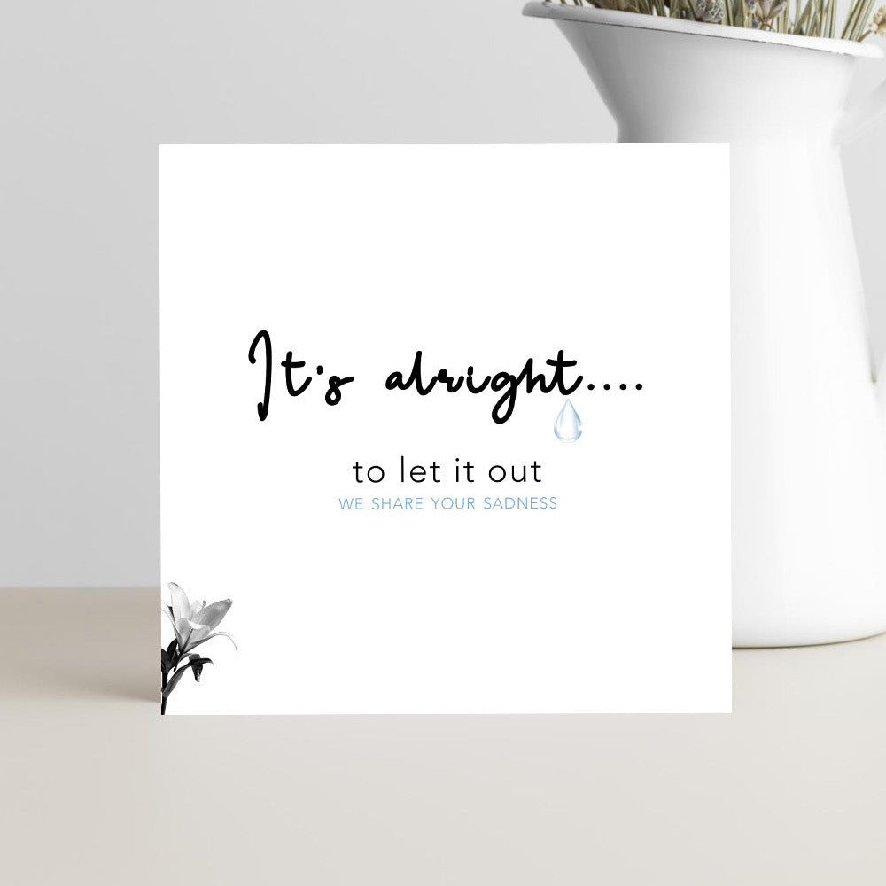 Minimalist sympathy card featuring the message "It's alright to let it out. We share your sadness" for condolences, grief, bereavement, and support.