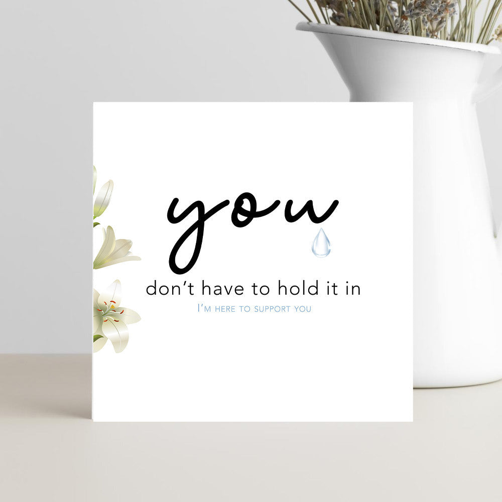 Minimalist sympathy card with a single tear and white flowers, featuring the message "You don't have to hold it in. I'm here for you" for condolences, grief, and support.