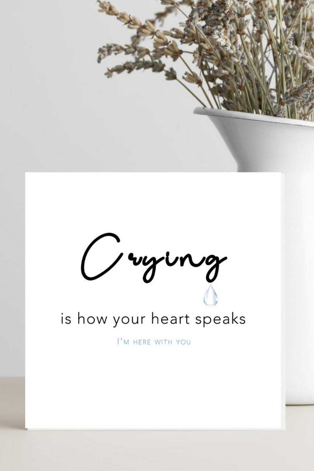 A minimalist condolence greeting card featuring the words “Crying is How Your Heart Speaks” in elegant script, placed on a soft neutral background conveying comfort, empathy, and warmth.