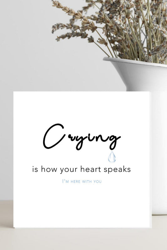 A minimalist condolence greeting card featuring the words “Crying is How Your Heart Speaks” in elegant script, placed on a soft neutral background conveying comfort, empathy, and warmth.