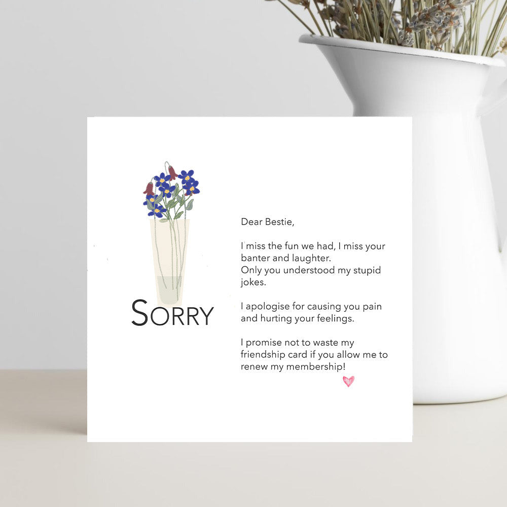 Card with apology message and flowers 