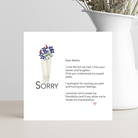 Card with apology message and flowers 