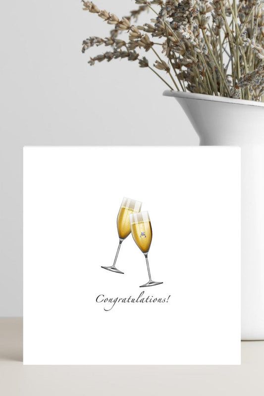 Greeting card with two champagne glasses and 'Congratulations!' text on a white background.