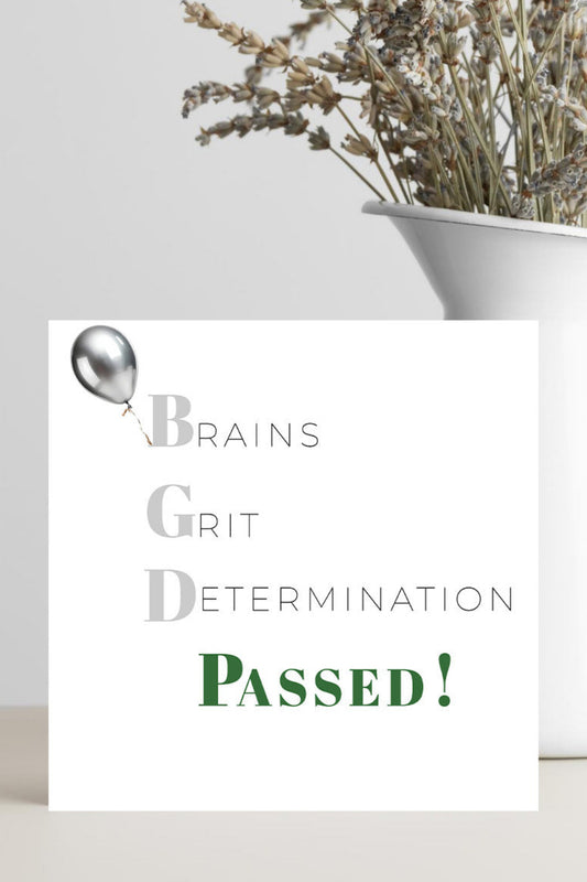 Motivational card with 'Brains, Grit, Determination Passed!' text on a white background.