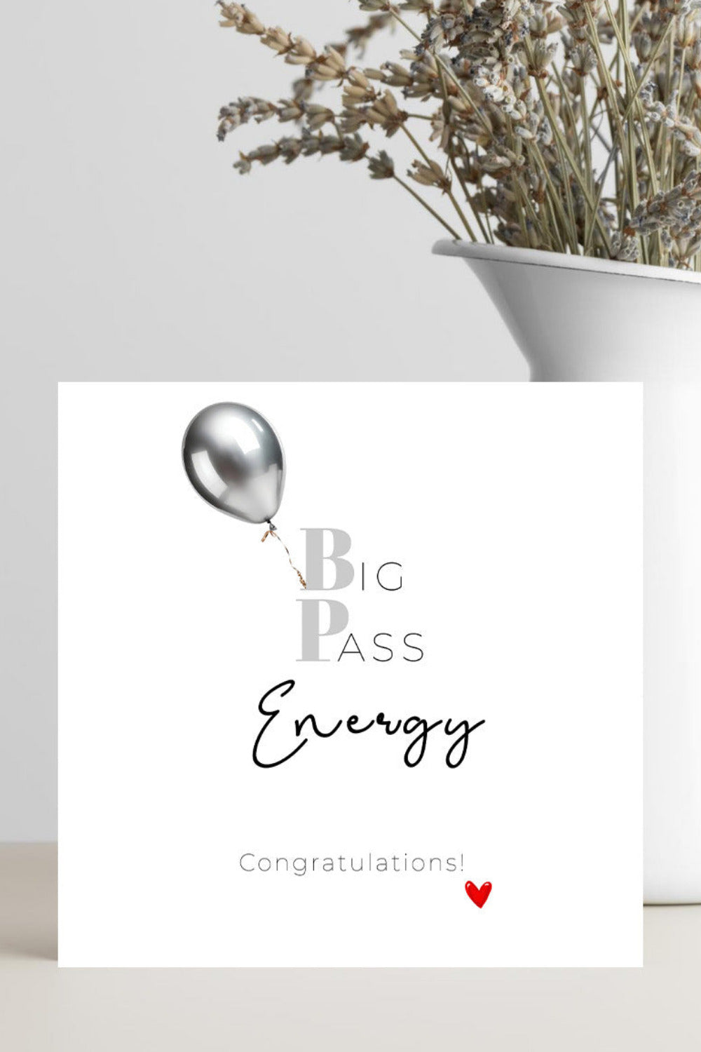 Greeting card with a silver balloon and text on a white background