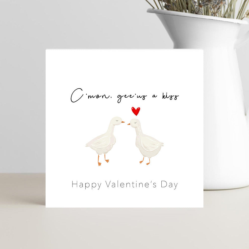 Funny Valentine’s Day card with the caption “Gee’us a kiss, happy Valentine’s Day”