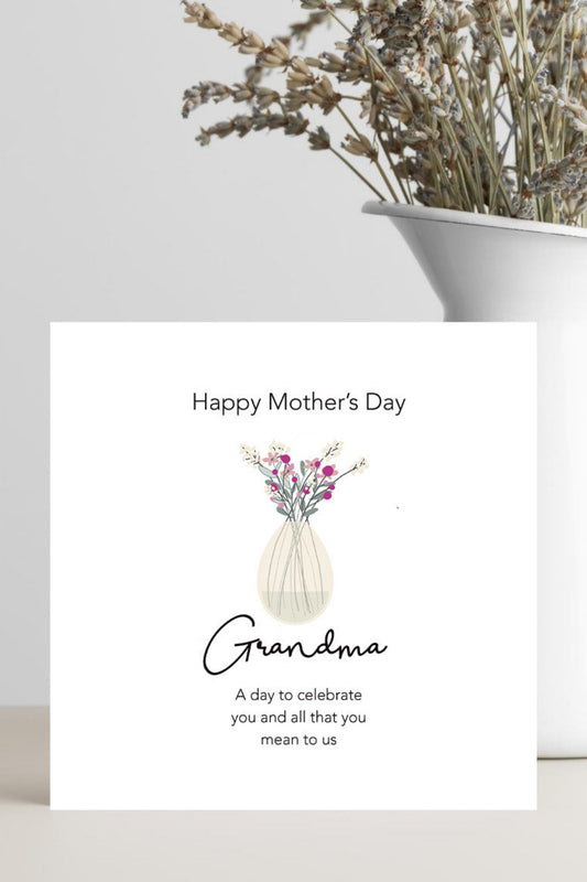 Mother's Day card for Grandma with a vase of flowers on a white surface.