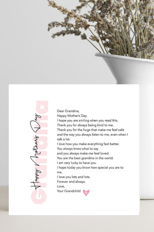 Greeting card with a heartfelt message on a white surface with a vase of dried flowers.