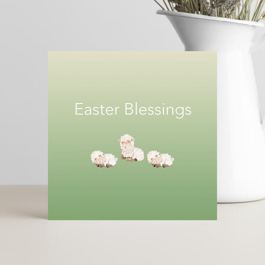 Easter Blessings greeting card with three cute baby lambs on the front