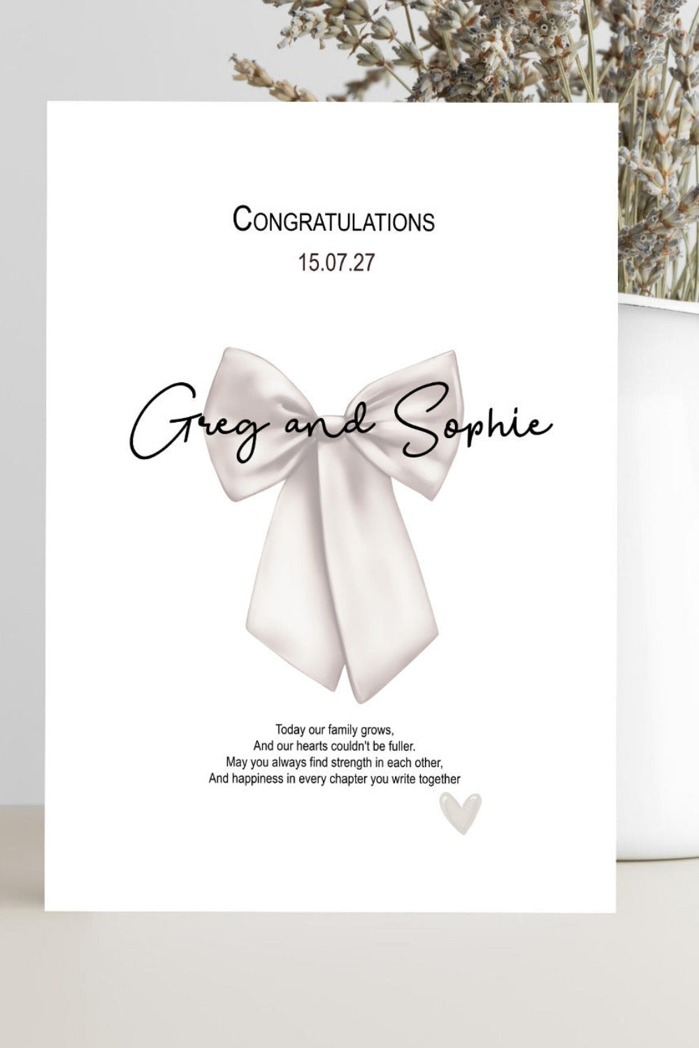 A personalized congratulations card with a white bow illustration and the text 'Congratulations 15.07.