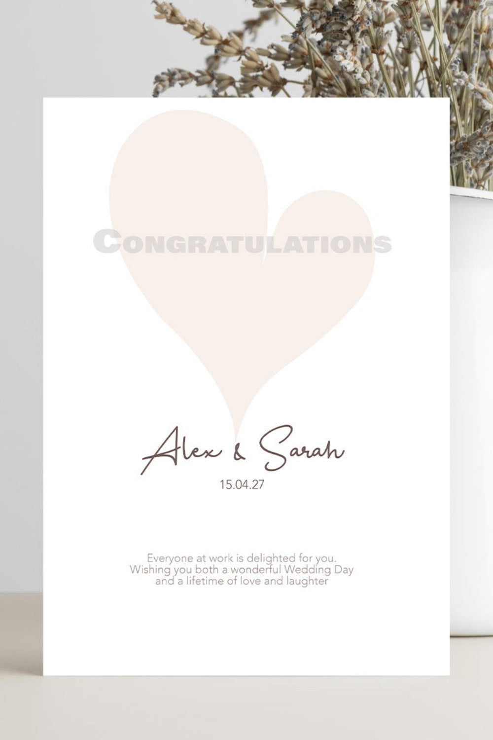A personalized wedding congratulations card with a large pale blush heart, the word 'CONGRATULATIONS' in faint letters, and the names 'Alex & Sarah' with the date '15.04.