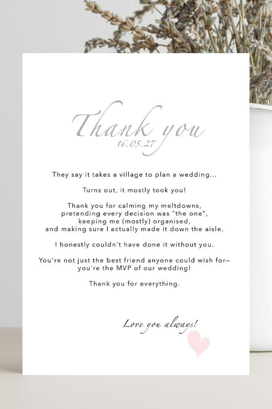A white wedding thank you card with elegant gray script and black text