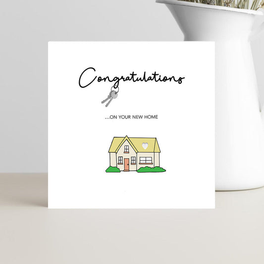 Playful new home congratulations card design featuring house keys for new homeowners