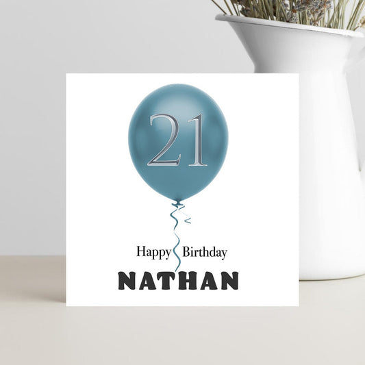 Birthday card with blue balloon and 'Happy Birthday Nathan' text.