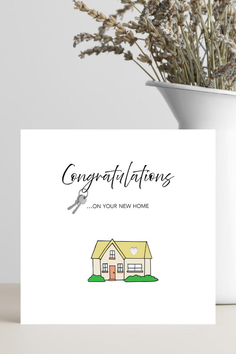 Playful new home congratulations card design featuring house keys for new homeowners
