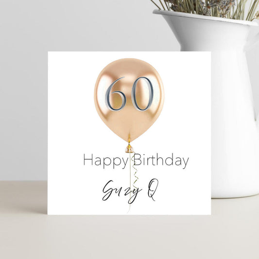 Personalised 60th birthday greeting card with colourful balloon design and custom name, handcrafted for a cheerful milestone celebration.