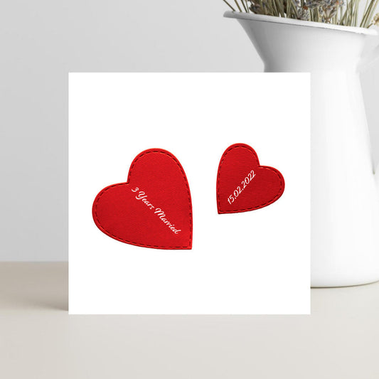 Card with red hearts and text on a white background.