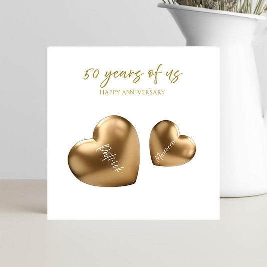 Anniversary card with gold hearts and '50 years of us' text on a white background.
