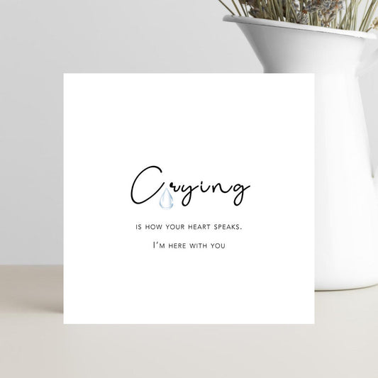 A minimalist condolence greeting card featuring the words “Crying is How Your Heart Speaks” in elegant script, placed on a soft neutral background conveying comfort, empathy, and warmth.