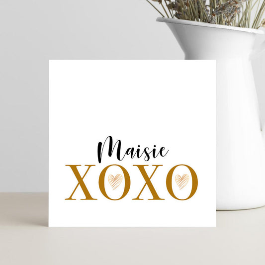 Personalised Maisie XOXO greeting card with gold lettering and heart design
