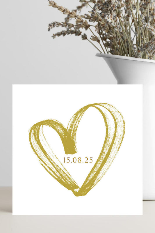square wedding card with hollow gold heart featuring the date you got married