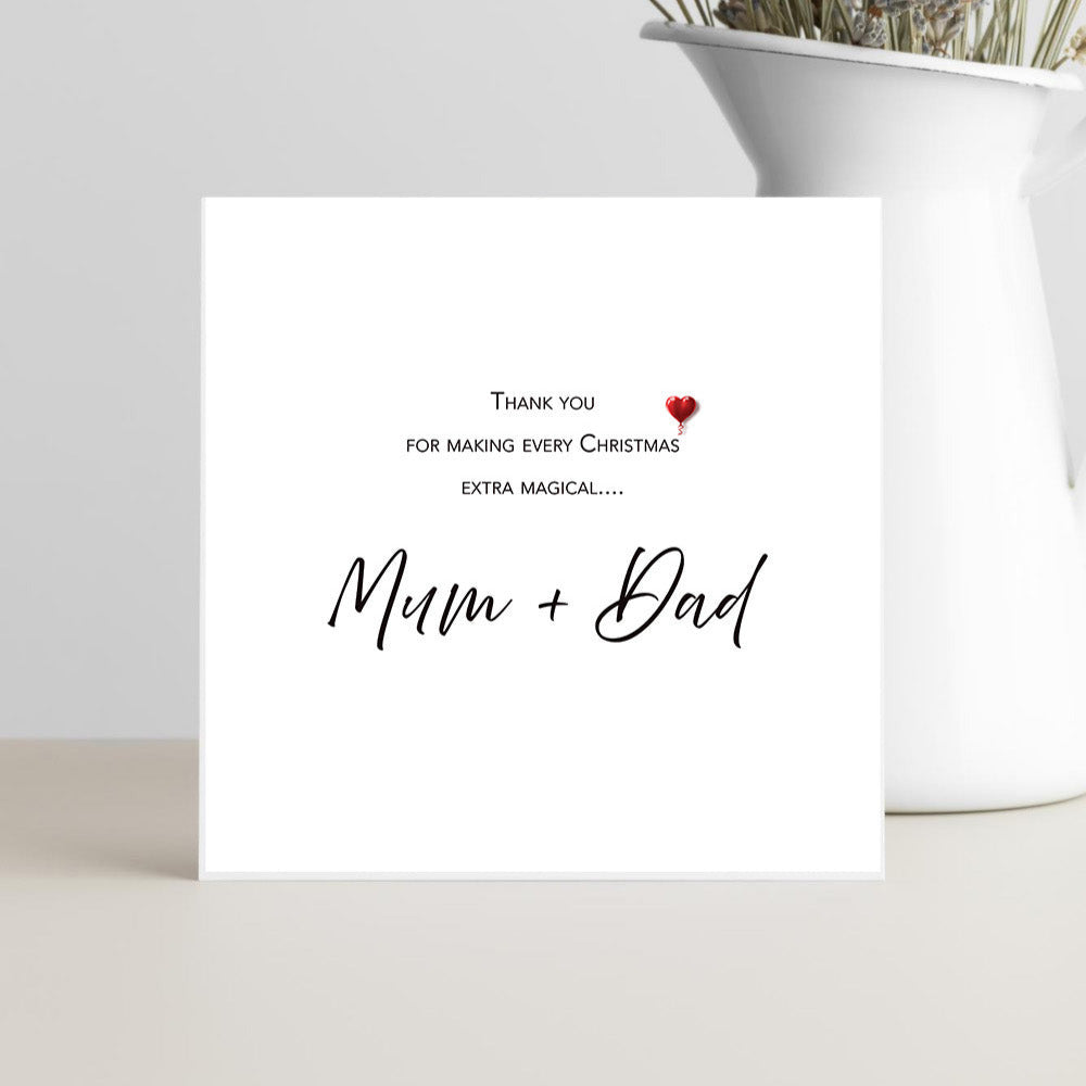 Greeting card with 'Thank you for making every Christmas extra magical... Mum + Dad' text on a white background.